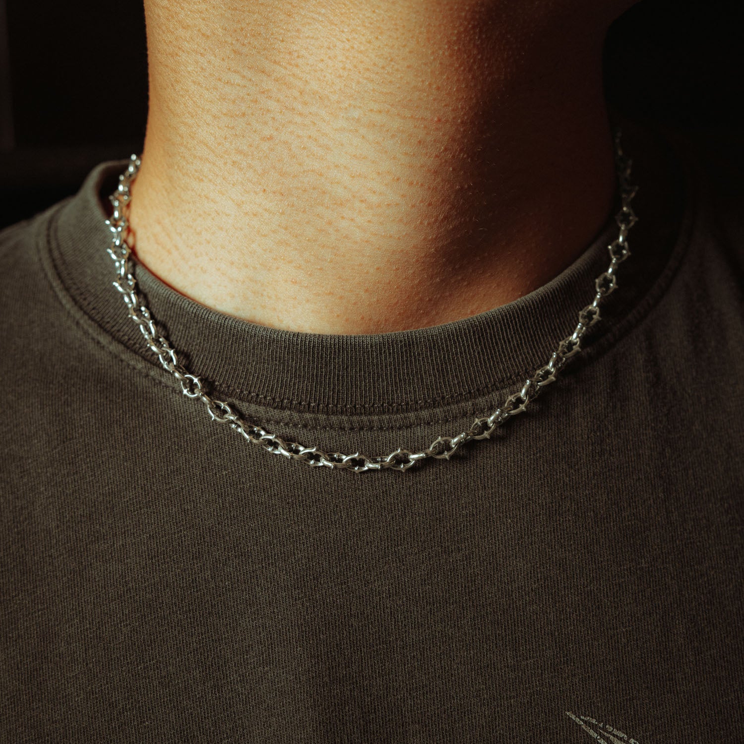 6mm spiked chain in sterling silver on male neck 