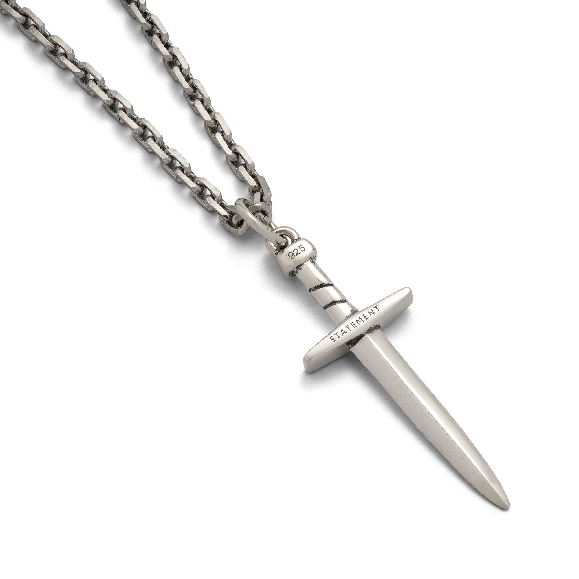 Silver chain with a dagger pendant on it, engraved with "Statement"