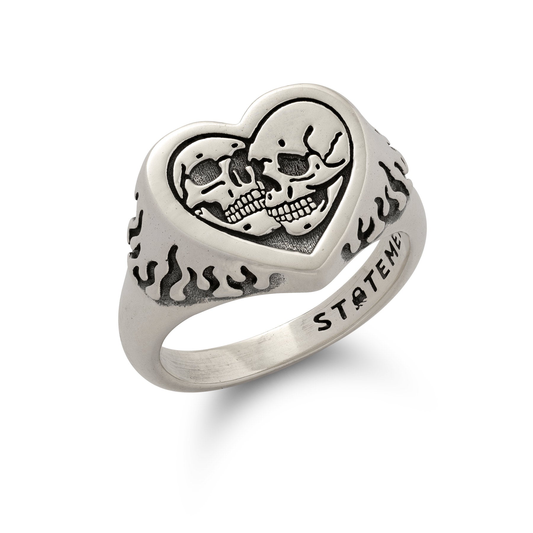 Sterling Silver heart shaped ring with skulls and flames on white background