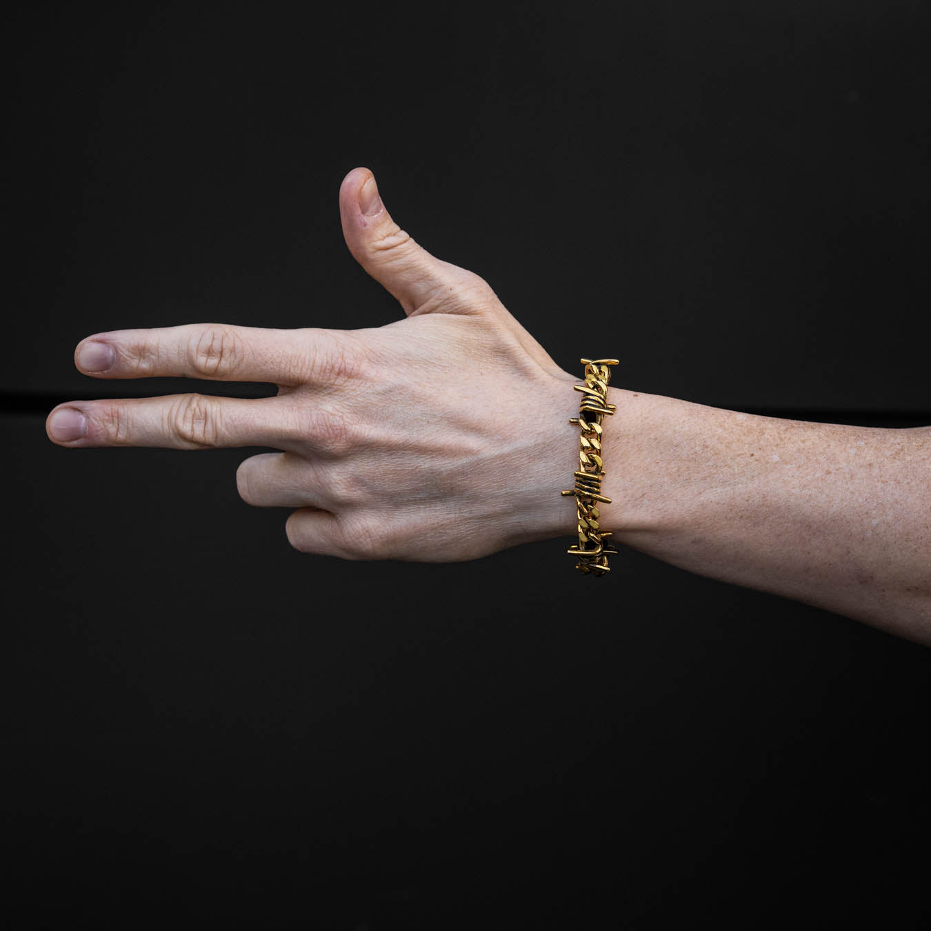 gold bracelet with barbed wire by statement