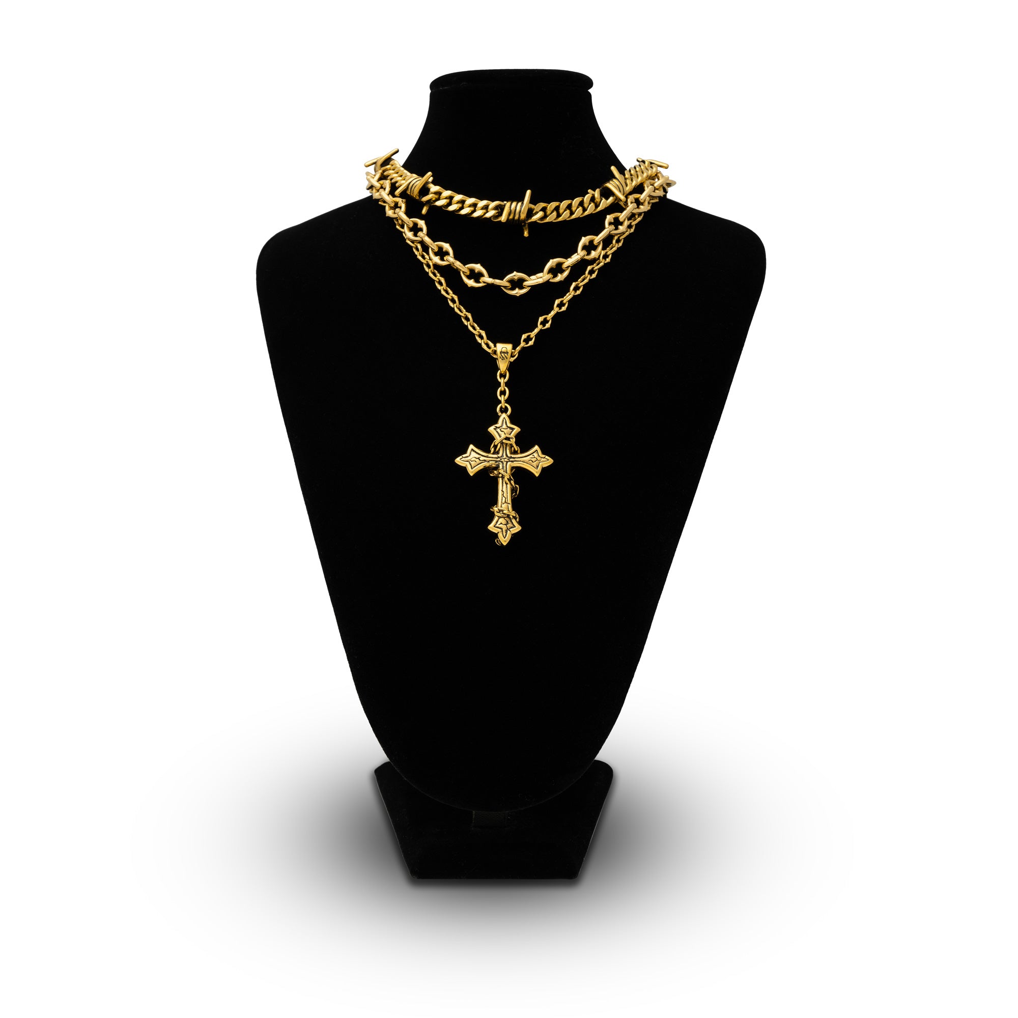 Gold chain set with barbed wire chain and spiked jewelry with cross pendant by Statement Collective