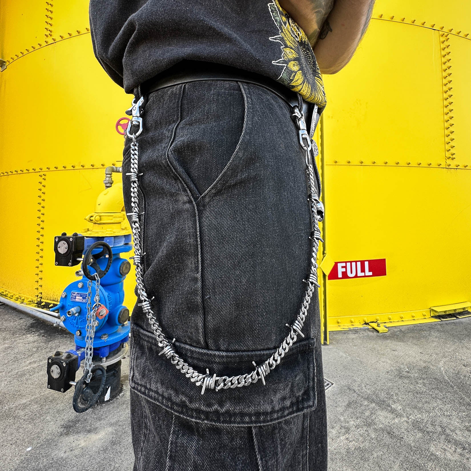 barbed wire belt chain on model by statement