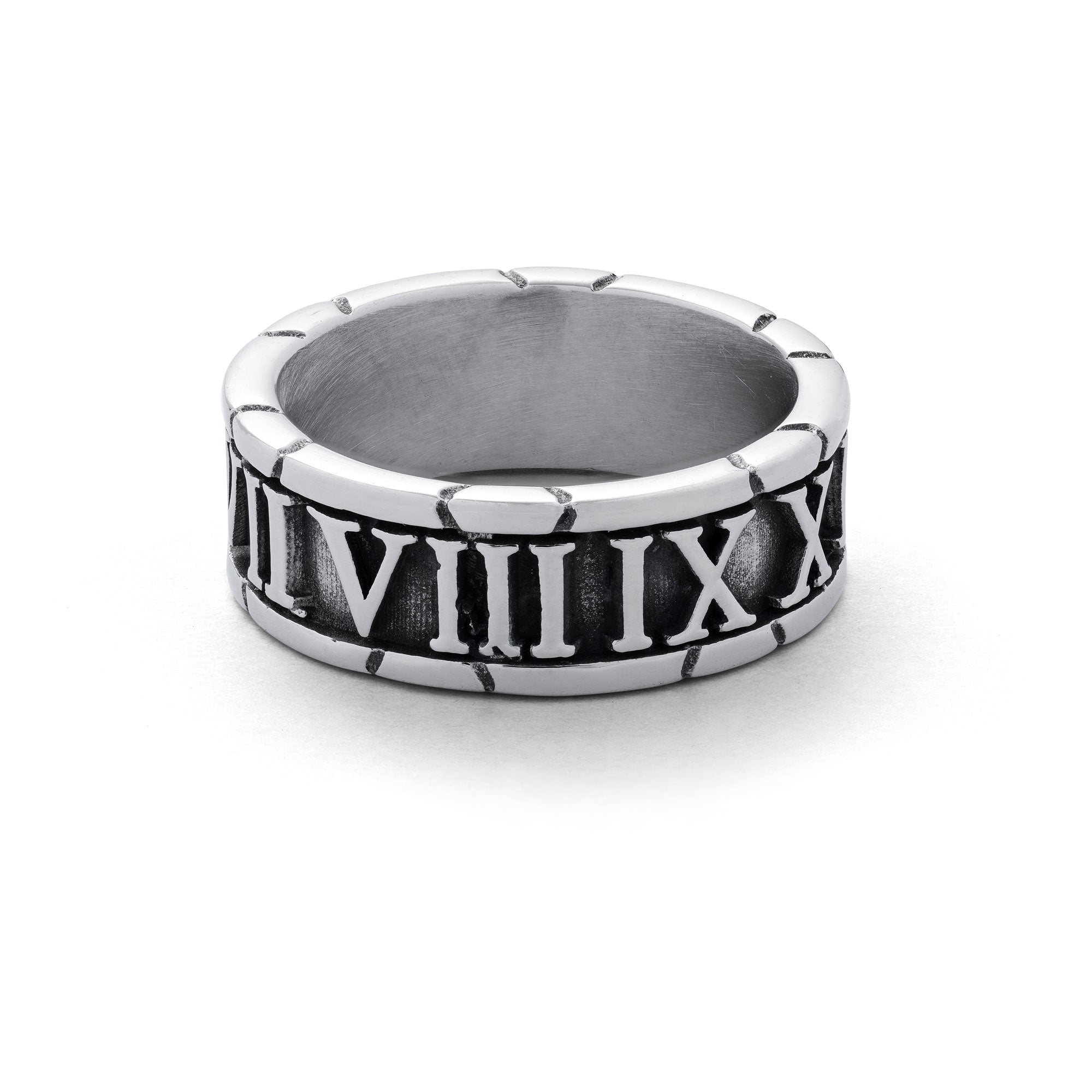 Silver band ring with roman numerals embedded around entirety of ring band.