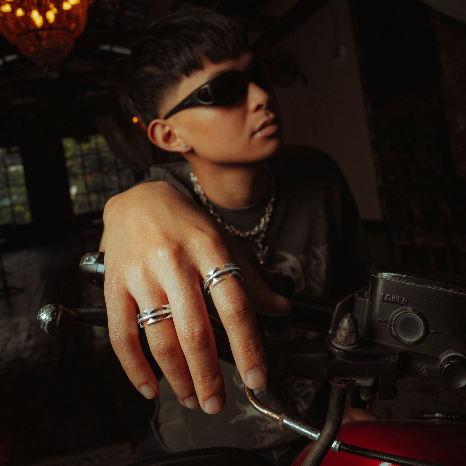 sterling silver razor wire ring on male model with sunglasses on motorbike